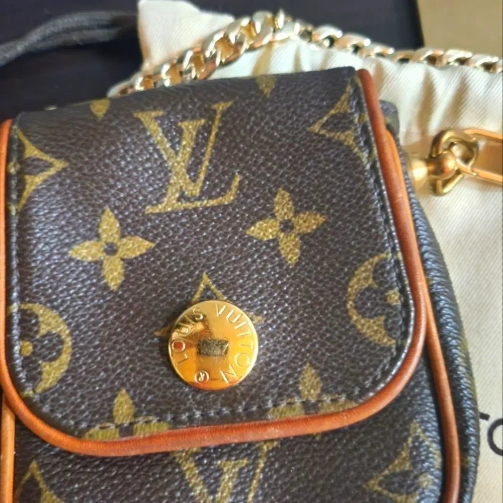 Louis Vuitton Pochette Cancun Monogram Mini Bag